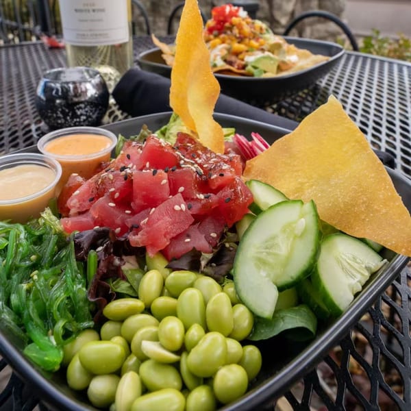 A J Liu of Dublin poke bowl with tuna, seaweed, edamame, cucumbers, and wonton chips.