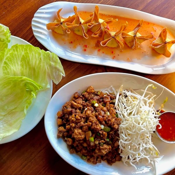 J Liu of Dublin's crab rangoon, lettuce wraps with chicken, bean sprouts, and crispy noodles.