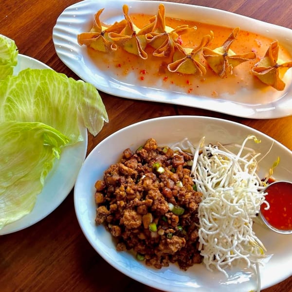 J Liu of Dublin's crab rangoons and lettuce wraps with ground chicken, bean sprouts, and sauce.